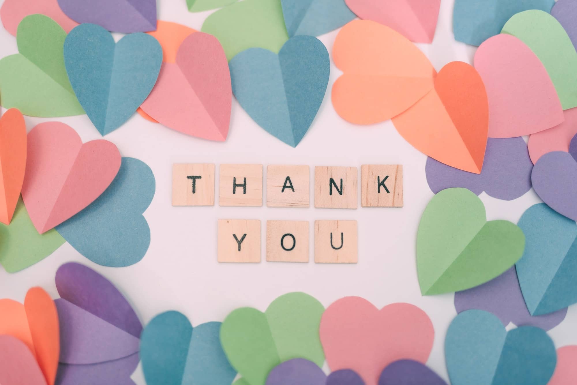 The word thank you surrounded by different colored hearts, Valentine’s
